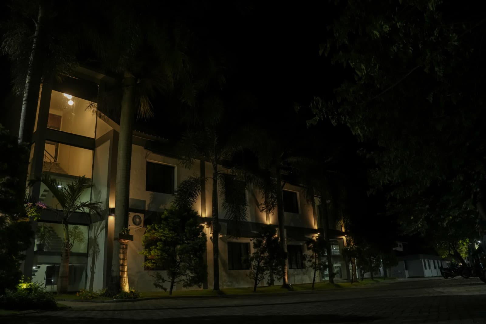 Palmshore Hotel evening illuminated grounds