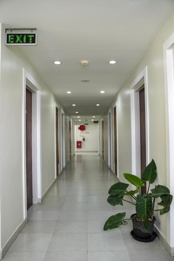 Tranquil guest corridor leading to courtyard gardens