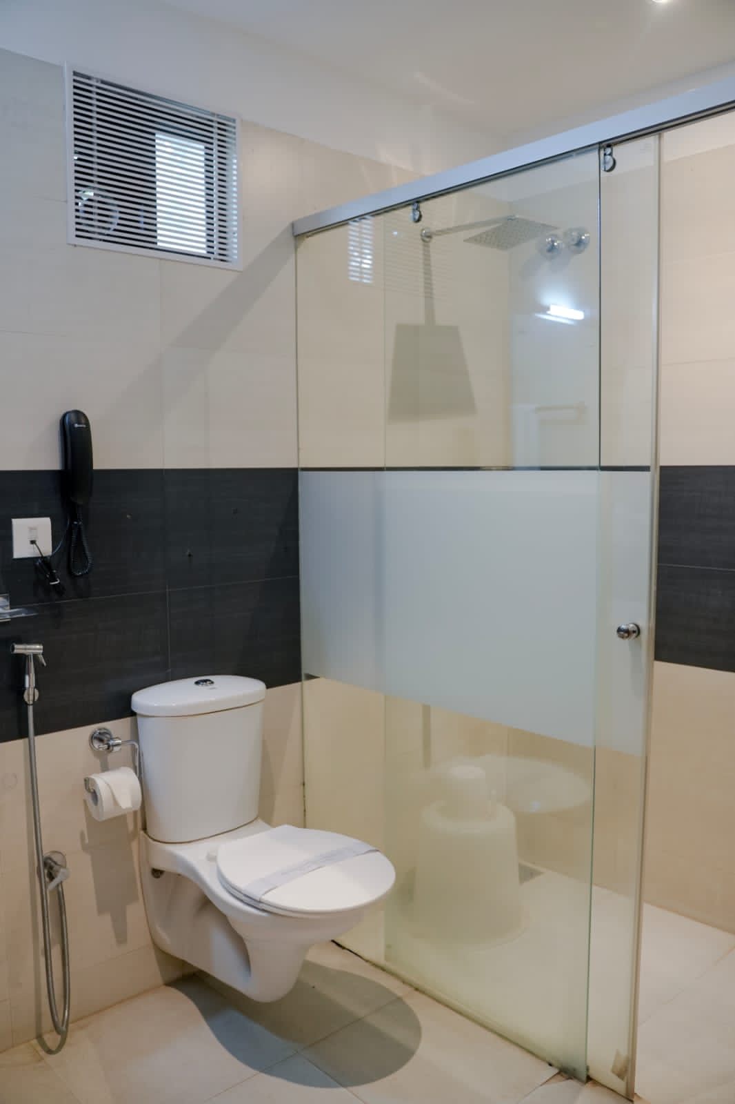 Contemporary bathroom suite with rain shower