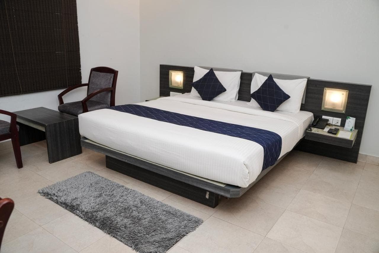 Master king bedroom with deep charcoal accents and shaggy rug